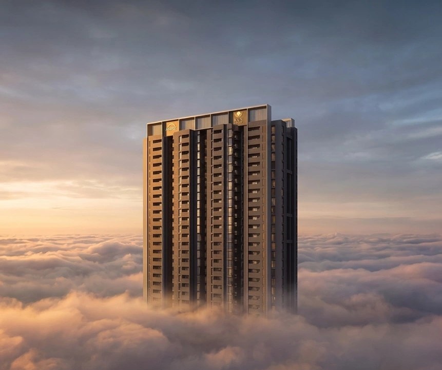 A Niwa & Neo tower rising above the clouds at dusk